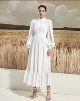 Long sleeve silk midi dress with pintuck bodice, gathered waist, and ruffle hem